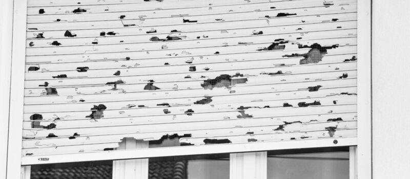 white window blinds with holes